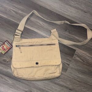 Fossil world traveler / messenger bag - unisex - comes luggage tag - preowned